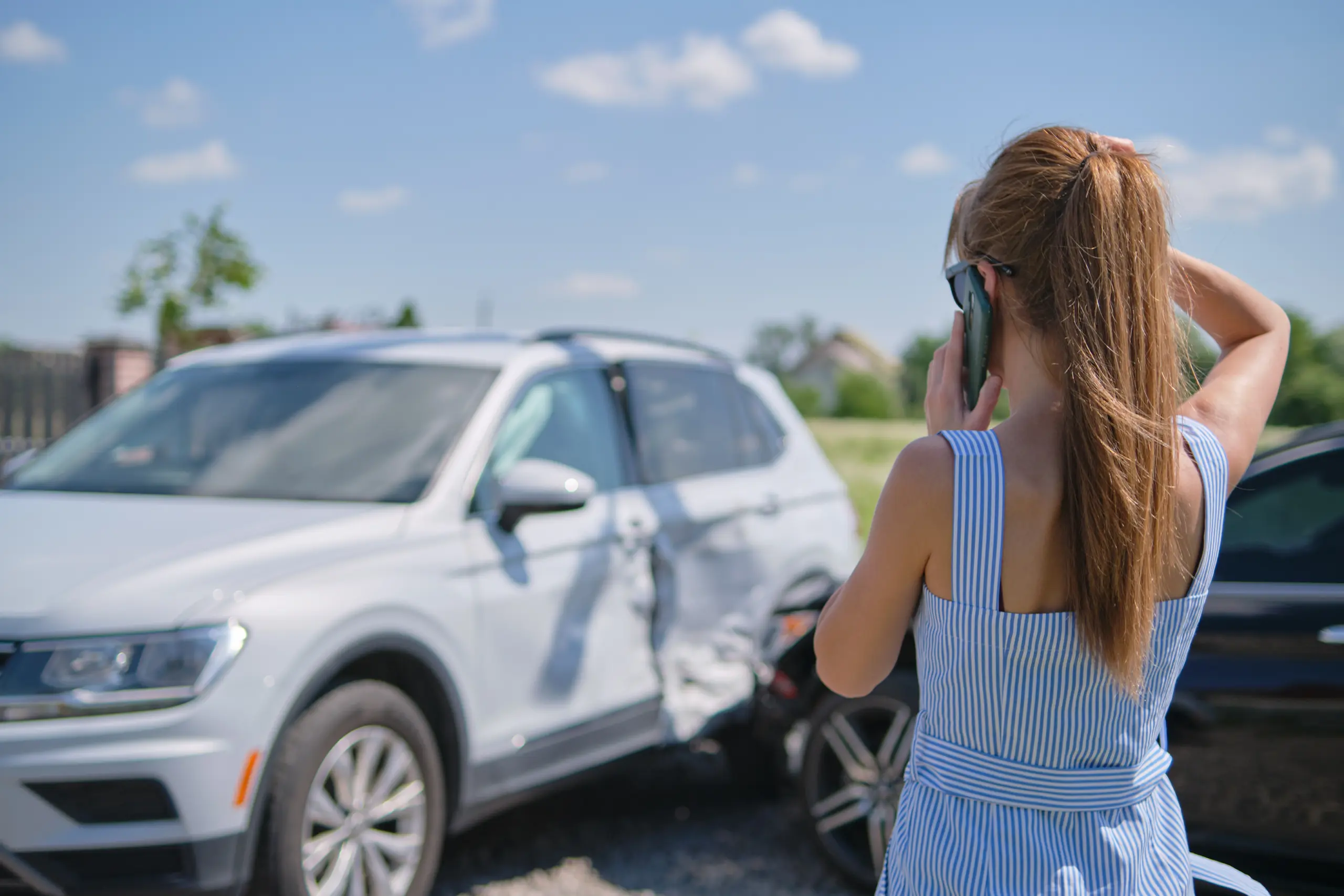 Woman calling for help after a car accident